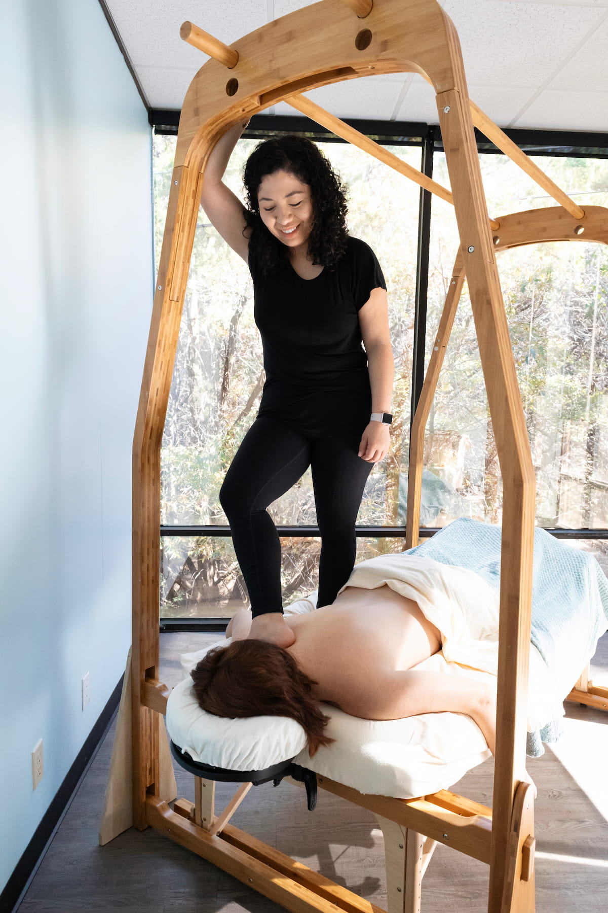 Lakshmi performing Ashiatsu barefoot massage